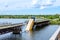 Destruction of bridge structures across the river with the collapse of sections into the water