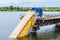 Destruction of bridge structures across the river with the collapse of sections into the water