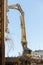 Destruction of building with hydraulic excavator/cutter crane