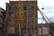 The destruction of the old building, reconstruction, structural changes. construction, high-rise crane works on the site. the