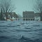 Destructive floodwaters surround homes during a relentless rainstorm