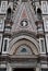 Detail, above a very elaborate door, of the wall of the cathedral Santa Maria del Fiore in Florence.