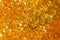 Detail of abstract orange bubble, can be used for background. Paste for sugaring close-up. Depilation and hair removal