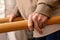 Detail of aged human hands grabbing parallel rehabilitation bars