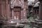 Detail of ancient buddhist temple in Thailand with red pink ornamented wall