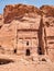Detail with the ancient burial chambers carved in red sandstone cliffs. Royal tomb facade in the ancient city of Petra, Jordan