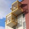 Detail of an apartment house with yellow balconies