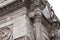 Detail of Arch of Constantine sculptural decoration with relief panels and statue in Rome, Italy