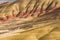 Detail of the arid, wavy and colorful landscape of Painted Hills