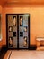 Detail of Art Deco style black lacquered door with Greek key pattern in the dining room at Eltham Palace.