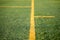 Detail of an artificial turf with yellow lines