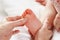 Detail baby having foot massage