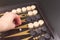 Detail of a backgammon game with two dice close up, on black. Dice on backgammon board game. Selective focus. Playing leisure