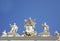 Detail from baroque Saint Peter`s colonnade with beautiful statues of saints and Pope Alexander VII coat of arms. Vatican City