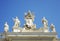 Detail from baroque Saint Peter`s colonnade with beautiful statues of saints and Pope Alexander VII coat of arms. Vatican City