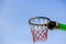 Detail of Basketball hoop in blue sky on a sunny day