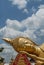 Detail of the beautiful golden reclined Buddha of the Pha That Luang temple in Vientiane, Laos