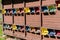 Detail of a bee house with many colorful stocked bee hives