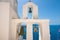 Detail of the bell tower of a Orthodox church. Fira town, Santorini, Greece.