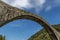 Detail from below of the ancient Ponte della Maddalena or Devil`s bridge, Lucca, Italy