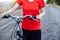 Detail of a bicycle. Female riders on mountain bikes through the