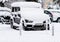 Detail of a black Mercedes SUV covered in snow. Winter season and icy cars parked on the road Bucharest, Romania, 2020