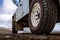 Detail of a black offroad tire on a offroad truck vehicle, built for dirty offroad roads