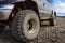 Detail of a black offroad tire on a offroad truck vehicle, built for heavy rides