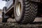 Detail of a black offroad tire on a offroad truck vehicle, built for heavy rides