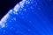 Detail of blue growing bunch of optical fibers background, fast