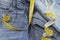 Detail of blue jeans with measuring tape.