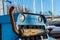 Detail of a blue large lifting truck used at a wharf to move boats..