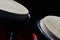 Detail of bongo drums macho on right and hembra on left, dark background