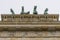 Detail of the Brandenburg Gate and the Quadriga above it in the center of Berlin, Germany, viewed from below