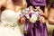 Detail and bride and bridesmaid with flowers