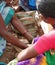 Detail, bright colored saris on tribal women