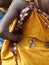 Detail, bright colored saris on tribal women