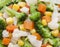 detail of broccoli, carrot, potato and corn kernels