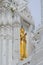 Detail of Buddha image & delicate stucco work in a prang in Wat Mahathat Worawihan, a Thai Buddhist temple, Phetchaburi