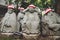 Detail of Buddha statues with knitted hat offerings at the temple Diasho-in in Miyajima, Hiroshima, Japan