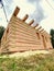 Detail of building from square beams from light spruce wood