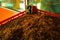 Detail of bulk Ceylon tea orange pekoe leaves being dried