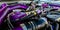 Detail of car engine components with purple tubes