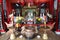 Detail of the censer and offerings in front of the altar of the Assembly Hall Of Fujian Chinese Temple in Hoi An