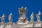 Detail of the Chigi coats of arms and the statues of saints that crown the colonnades of St. Peter Square built on 1667 on the