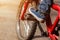 Detail of child cyclist feet riding bike on outdoor in sunny road. Closeup on pedal and foot