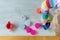 Detail of child having fun playing with colorful dough at home.