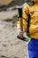 Detail of child in overalls with hammer in action - boy in workwear