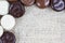 Detail of chocolate kruidnoten on burlap surface