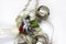 Detail of Christmas decoration with white ribbon and gold details. Silver angel .
